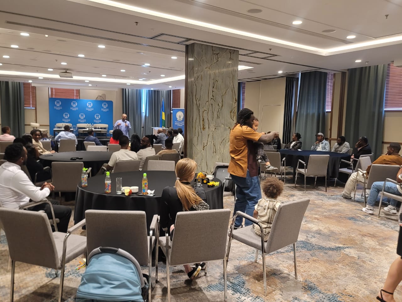 Embassy official speaking to attendees during the Gdańsk community meeting